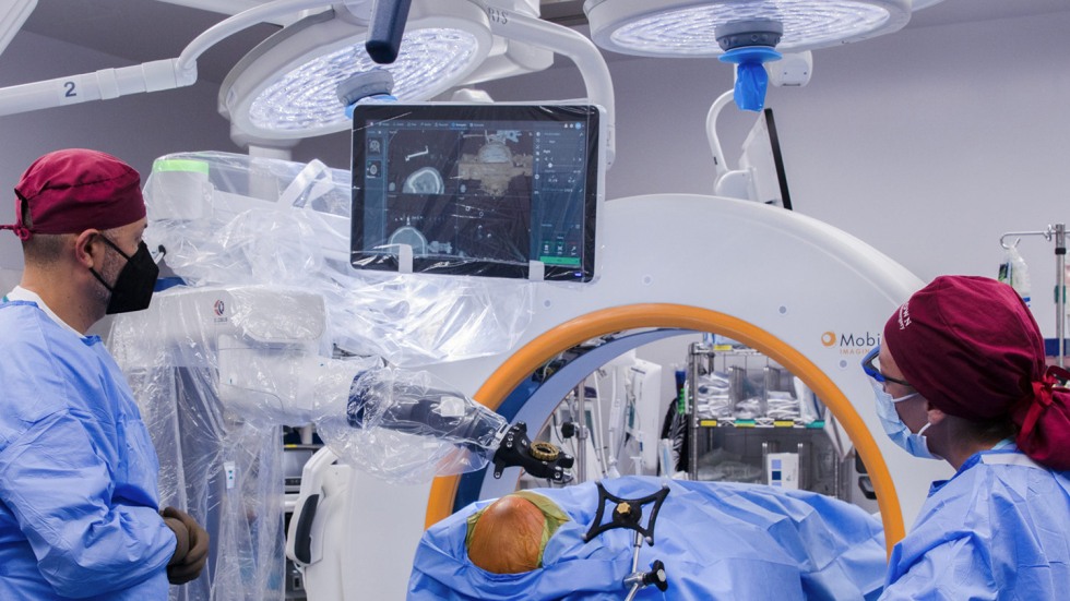 Dr. Asaad performing the first cranial robotic case at Rhode Island Hospital.